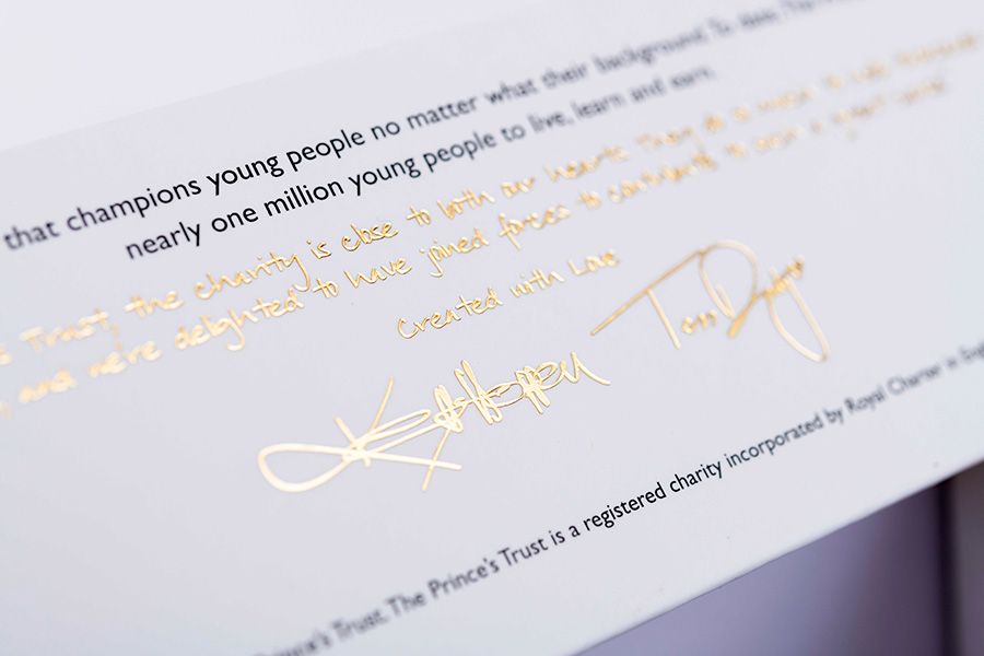 Gold foiled signature on a rigid box